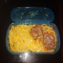 A picture of Spagetti with carrots and chicken.