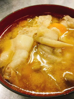 A picture of Miso soup with pork and vegetables   "Tonjiru".