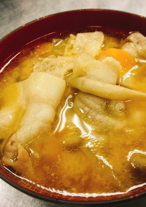 A picture of Miso soup with pork and vegetables   "Tonjiru".