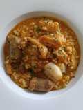 Arroz Mar y Montaña de Rape y Butifarra con Sofrito de Calamar y Gambas