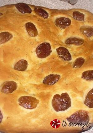 A picture of Lagana with olives and rosemary.
