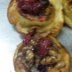 A picture of Mini cinnamon rolls with cranberry walnut compote.