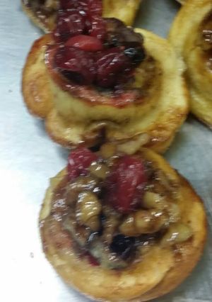 A picture of Mini cinnamon rolls with cranberry walnut compote.