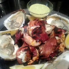 A picture of Grilled Jumbo Stuffed Shrimp Wrapped in Bacon.