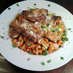A picture of Pan Seared pork chops with a Quick Pan Sauced Pasta.