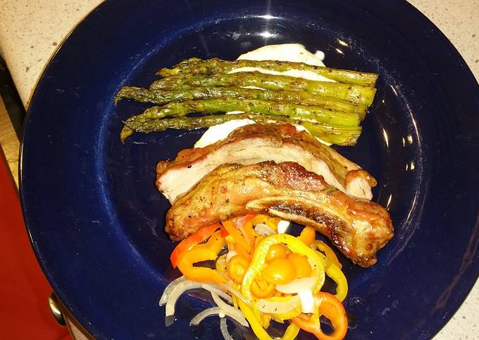 Sticky Asian pork  ribs with grilled asparagus over red wine feta aioli