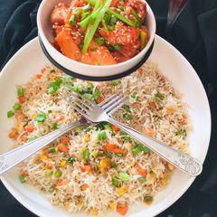 A picture of Chilli Chicken with egg fried Rice.