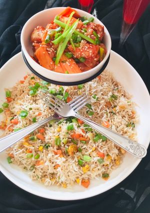 A picture of Chilli Chicken with egg fried Rice.