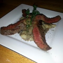 A picture of creamy mushrooms gnocchi with wagyu beef.