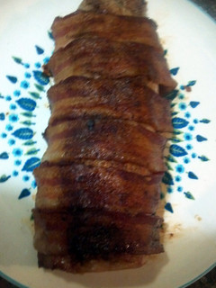 A picture of Bacon wrapped pork loin.