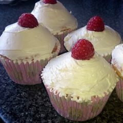 A picture of raspberry / blueberry / chocolate chip / cola bottle cupcakes.