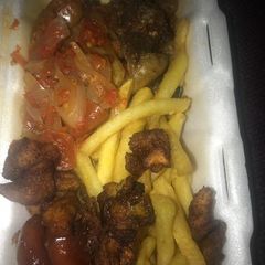 A picture of Fried Plantain and Irish Potatoes serve with pepper sauce.