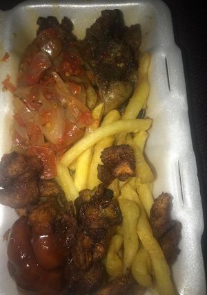 A picture of Fried Plantain and Irish Potatoes serve with pepper sauce.