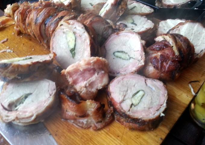 Pork tenderloin stuffed with herbs and garlic, wrapped in bacon