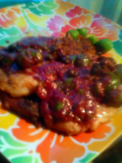 A picture of Pork Scaloppini with Olives In Red Wine Sauce.