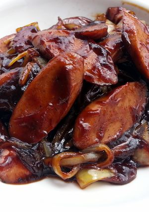A picture of Sausage And Onion In BBQ Sauce.