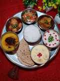 NORTH INDIAN THALI for Lunch..Dal, Aloo Dum, Kaddu sabzi, Rice, Roti, Raita, Salad, Custard.