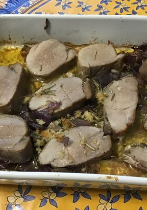 A picture of Oven-Roasted Pork Tenderloin with Pink Garlic, Red Onion, and Rosemary.