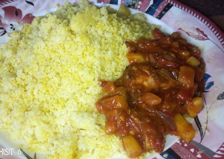 Get Lunch of Curry cous cous with Irish potatoes sauce