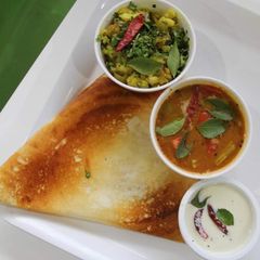 A picture of Masala dosa chutney and sambar.