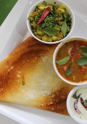 A picture of Masala dosa chutney and sambar.