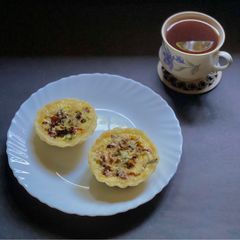 A picture of Mini quiche of sun-dried tomatoes & Indian basil.