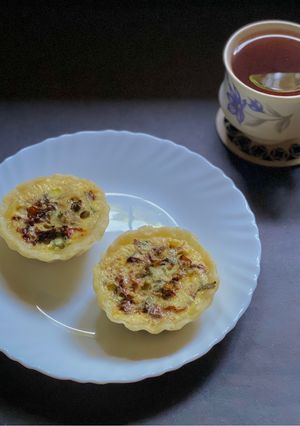 A picture of Mini quiche of sun-dried tomatoes & Indian basil.