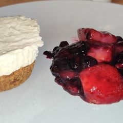 A picture of Vanilla cheese cake and berry compote.