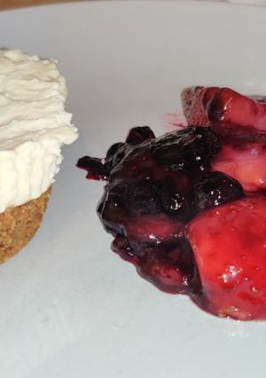 A picture of Vanilla cheese cake and berry compote.