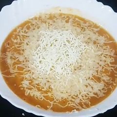 A picture of Apple carrot soup.