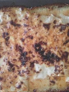Una foto de Canelones con queso gratinados