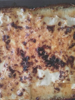 Una foto de Canelones con queso gratinados