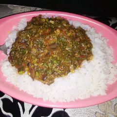 A picture of White Rice with Vegetable Soup.