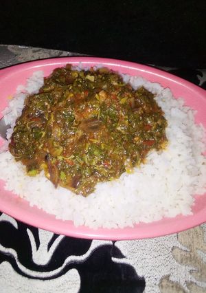 A picture of White Rice with Vegetable Soup.