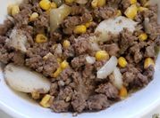 A picture of goulash with corn