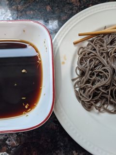 A picture of Cold soba with dipping sauce.