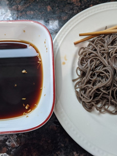 A picture of Cold soba with dipping sauce.