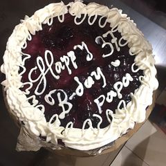 A picture of 37 years of love blueberry cheesecake.