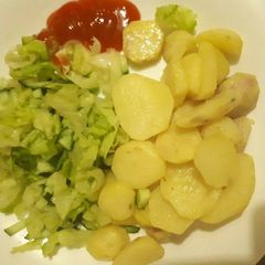 A picture of Fried potatoes and salad.
