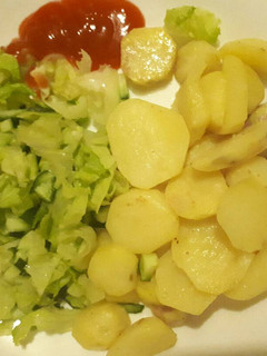 A picture of Fried potatoes and salad.