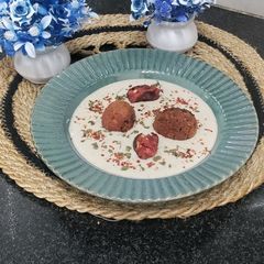 A picture of Nargisi Malai Kofta with Cashew Kewra gravy.