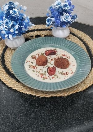 A picture of Nargisi Malai Kofta with Cashew Kewra gravy.