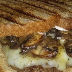 A picture of French onion and Swiss burgers.