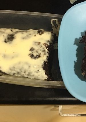 A picture of Super moist banana chocolate cake with sour creme dressing.