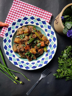 A picture of Chicken curry with winter veggies.