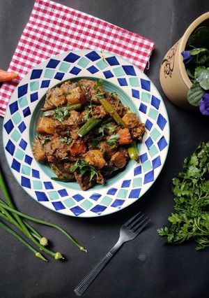 A picture of Chicken curry with winter veggies.