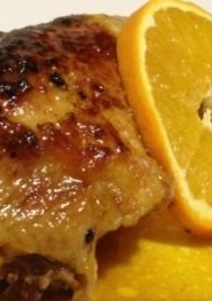 Una foto de Pollo asado con naranjas