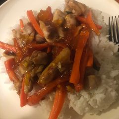 A picture of Twice-fried chicken thighs with plum sauce.