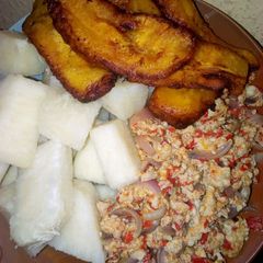 A picture of Boiled yam,egg sauce and plantain.