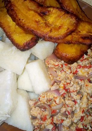 A picture of Boiled yam,egg sauce and plantain.